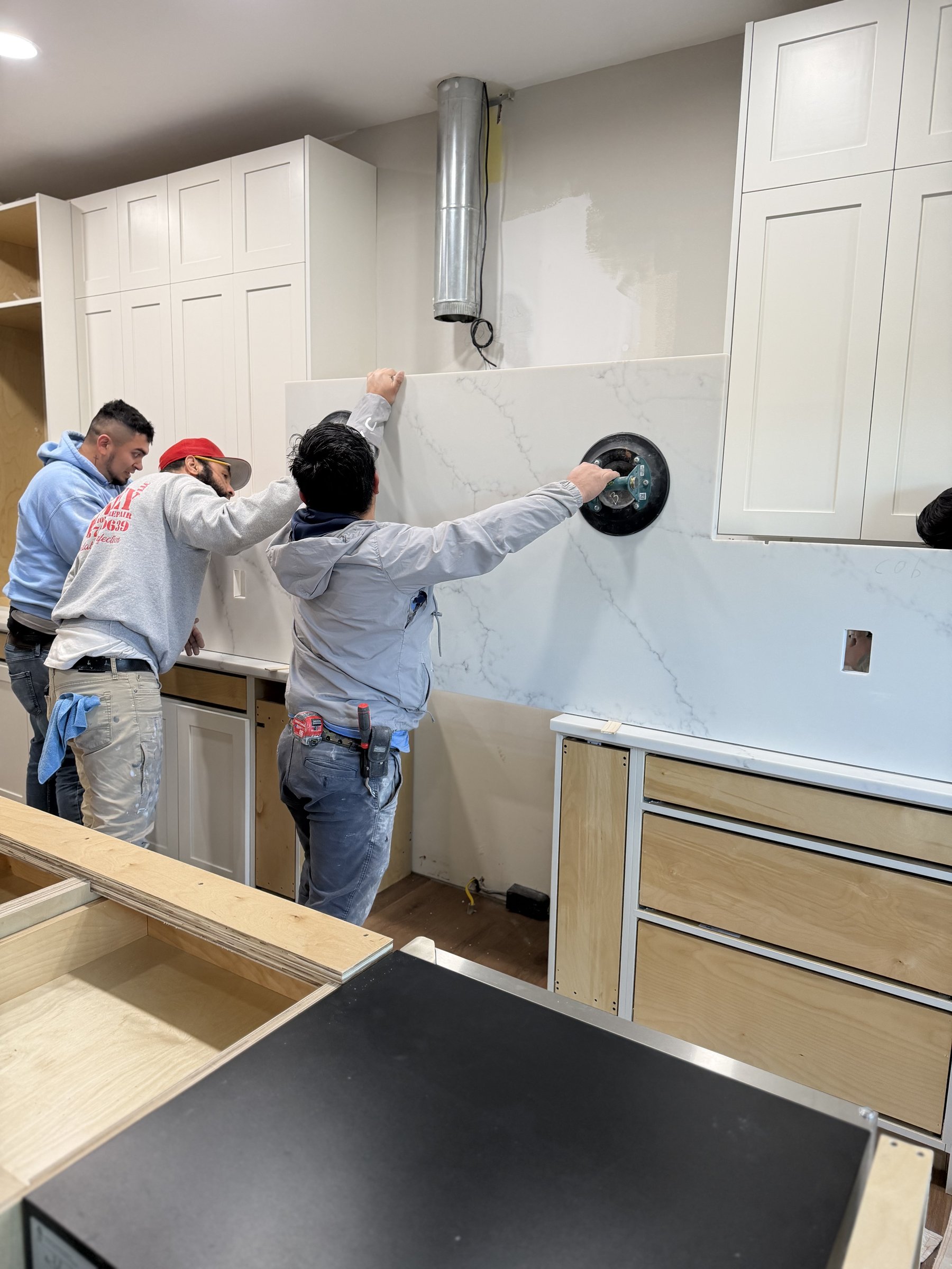Hatley crew installing quartz countertop